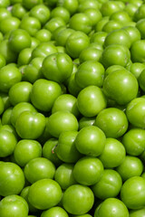 Delicious green and juicy plums at the market