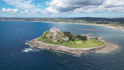 St Michael's Mount is a tidal island in Mount's Bay, Cornwall, England, United Kingdom. The island is a civil parish and is linked to the town of Marazion by a causeway of granite setts, passable bet
