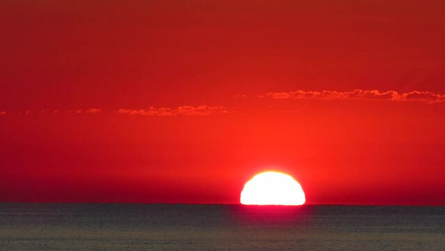 timelapse sunrise sun rising in reddish sea coast valencia spain beach