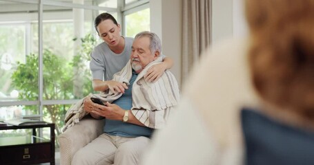 Senior, man and caregiver with blanket for care or support for retirement service in nursing home with kindness and homecare. Nurse, mature male person and relax on sofa with cellphone and healthcare