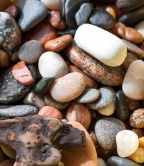 Sea rocks background. Different form colorful smooth stones.
