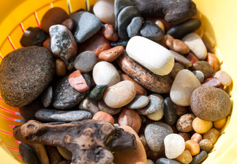 Sea rocks background. Different form colorful smooth stones.