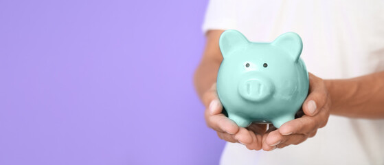Male hands with piggy bank. Money savings concept