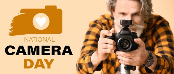 Mature photographer on beige background. Banner for National Camera Day