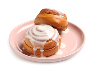 Plate with tasty glazed cinnamon buns on white background