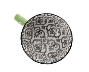Ceramic ornamental green cup on white background. Top view
