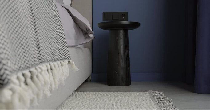 Modern bedroom interior design with bed bedside table carpet. Real minimalist bedroom interior