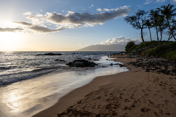 Tropical vacation paradise, beach seascape on the Pacific Ocean at sunset, Mōkapu Beach, Maui, Hawaii
