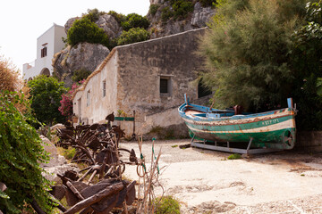 Old boat in the courtyard of the former Tonnara di Scopello