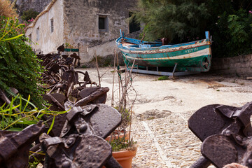 Old boat in the courtyard of the former Tonnara di Scopello