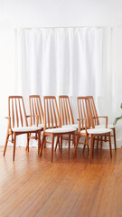 Vintage 1960s Dining Chairs. Chunky white textured upholstery on stylish Mid-Century Modern chairs. Photographed in a home interior. 