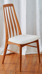 Vintage 1960s Dining Chair. Chunky white textured upholstery on stylish Mid-Century Modern chair. Photographed in a home interior. 