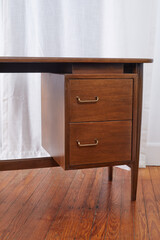 Mid-Century Modern Desk. Vintage walnut office furniture. Photographed in a home interior. 