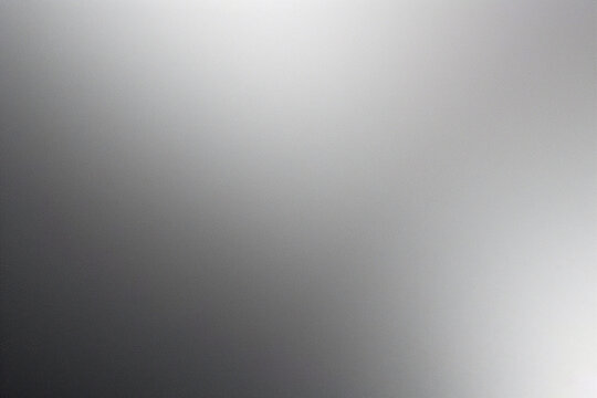 A tight shot of a polished metal surface adorned with a silver pattern, overlain by silver metallic foil

