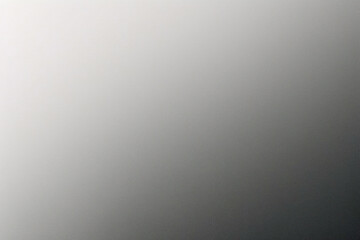 A tight shot of a polished metal surface adorned with a silver pattern, overlain by silver metallic foil
