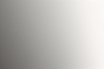 A tight shot of a polished metal surface adorned with a silver pattern, overlain by silver metallic foil
