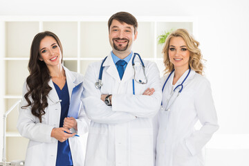 Fototapeta premium Doctors stand shoulder to shoulder