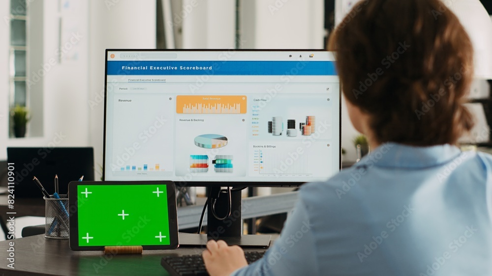 Poster office worker checks greenscreen display on tablet, working on business operations with isolated cop