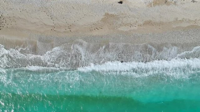Top Down over Waves and Beach in Himare from a drone, Albanian Riviera, Albania