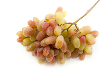 Bunch of organic pink grapes isolated on white background.