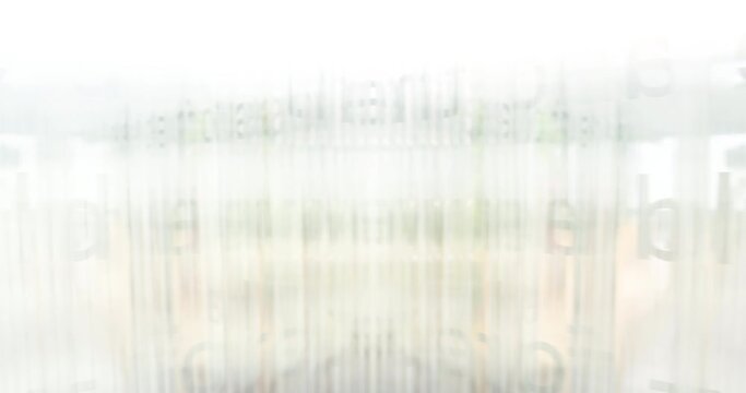 An abstract image displaying a digital glitch effect with text and light streaks, creating a disoriented visual