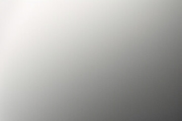 A tight shot of a polished metal surface adorned with a silver pattern, overlain by silver metallic foil
