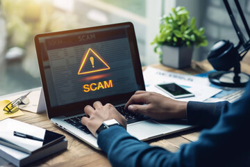 Cybersecurity alert: online scam warning on laptop screen