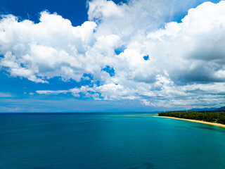 Aerial view of a blue sea surface water texture background,Sun reflections over ocean, Aerial flying drone view Waves water surface texture on sunny tropical ocean in Phuket island Thailand