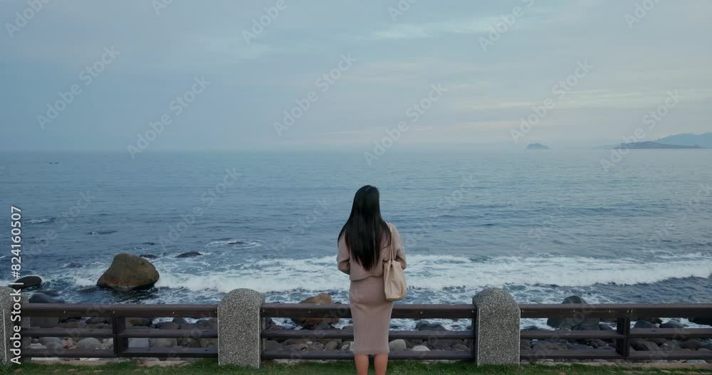 Poster woman look at the sea at taipei north coast