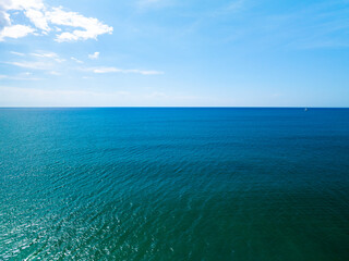 Aerial view of a blue sea surface water texture background,Sun reflections over ocean, Aerial...