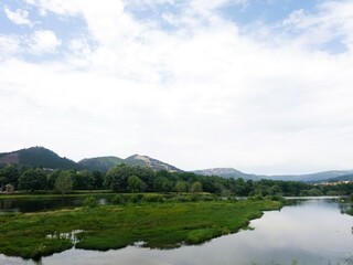 Obraz premium Natural landscape. A lake surrounded by woods