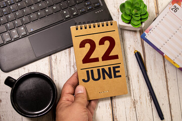 22 june wooden calendar in white background