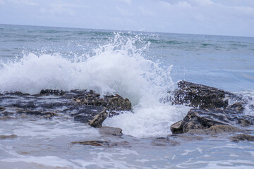 waves crashing on rocks