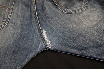 Crotchless jeans are torn due to use or accidents waiting to be repaired.