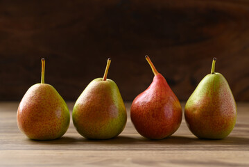 Fresh pear fruit on wooden background
