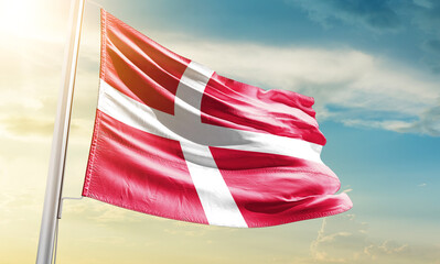 Denmark national flag waving in beautiful sky.