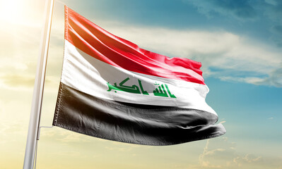 Iraq national flag waving in beautiful sky.