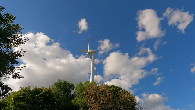 Ecological energy source. Zipline Frottmaninger Berg. Turbine Frottmaninger Mullberg. Windrad Frottmaninger Mullberg. Windmill in Munich. Renewable energy concept. Wind turbine against sky in Germany