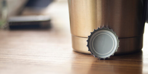 close up bottle cap on wood table