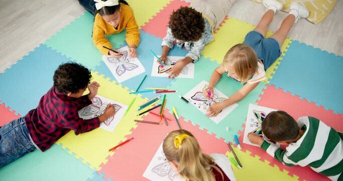 Children, friends and art drawing in classroom for project, back to school or artistic. Boys, girls and pencils on floor for learning education or elementary lesson or paper, coloring or development