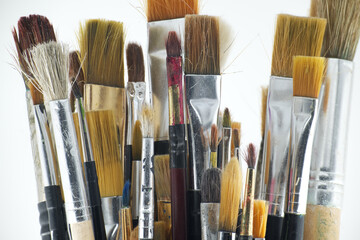 Assortment of various types and sizes of paintbrushes