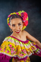 A woman wearing a colorful dress and a flowery headband