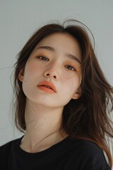 Fototapeta premium Sweet-Faced Korean Girl with Middle Part Hairstyle