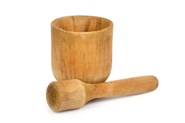 Antique wooden mortar and pestle on a white background. Old simple wooden dishes.