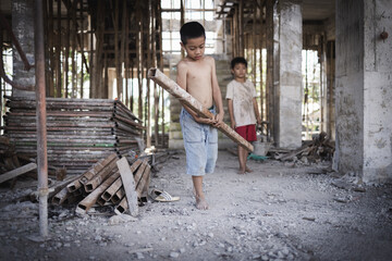 Two poor children are forced to work in construction. Poor children, poverty, Child labor, World...