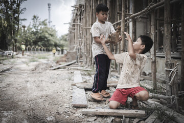  Poor children are forced to work in construction. are forced to work in the construction area. Human rights concepts, stopping child abuse, violence, fear of child labor and human trafficking.