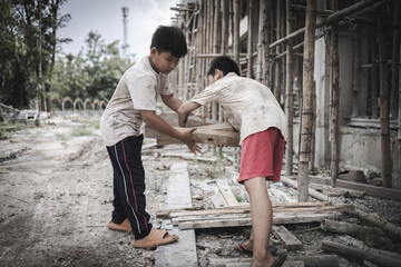  Poor children are forced to work in construction. are forced to work in the construction area. Human rights concepts, stopping child abuse, violence, fear of child labor and human trafficking.