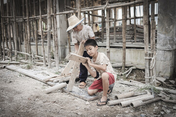  Poor children are forced to work in construction. are forced to work in the construction area. Human rights concepts, stopping child abuse, violence, fear of child labor and human trafficking.