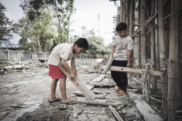  Poor children are forced to work in construction. are forced to work in the construction area. Human rights concepts, stopping child abuse, violence, fear of child labor and human trafficking.