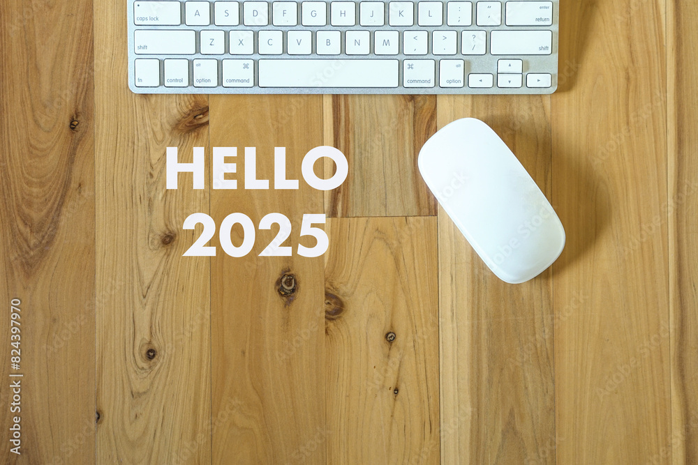 Fototapete Hello 2025, words next to computer keyboard and mouse. New year concept.